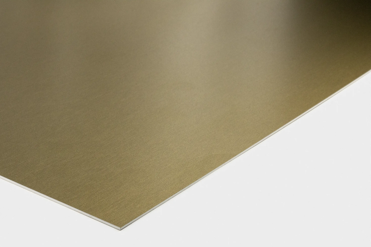 Brass-effect aluminium sign plate with a warm gold brushed finish