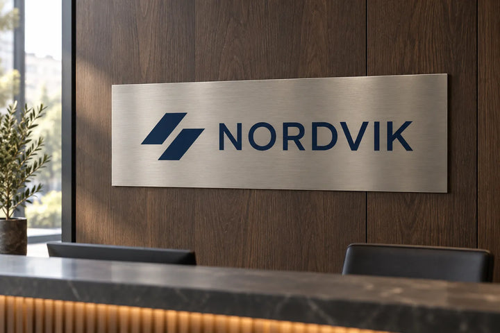 Brushed aluminium logo sign on a reception wall