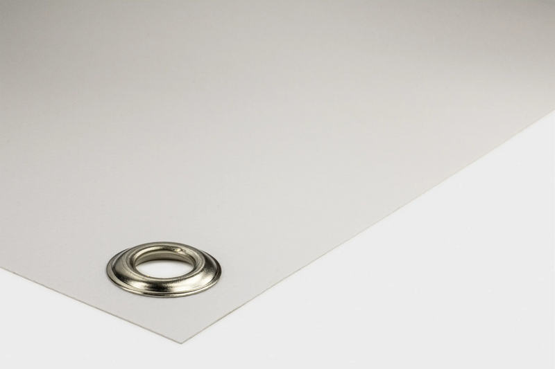 White PVC banner corner with a metal grommet eyelet