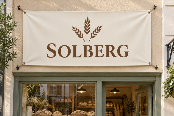 PVC banner with logo above a bakery shop front